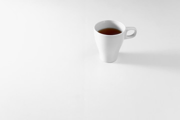 Cup of tea on white background. A white tea mug on a white background