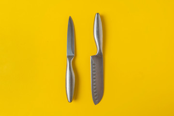 knives on yellow background