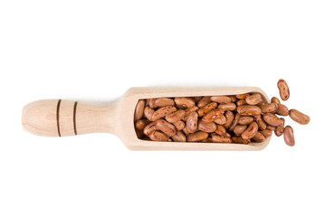  Pinto bean in wooden scoop isolated on white background. nutrition. bio. natural food ingredient.