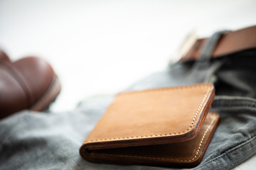 Brown nubuck leather men’s wallet leather and accessory isolated on white background. selective focus