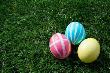 Painted Easter eggs on green grass