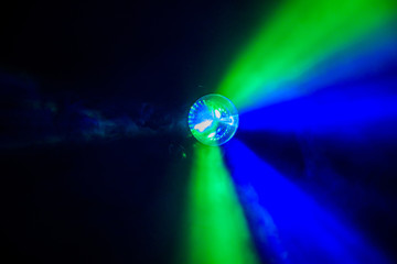 illumination of light and smoke. Abstraction background. multicolored light from the lamp.