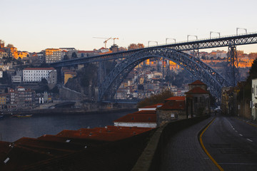 Dom Luis I bridge and Douro river during sunrise, Porto - Portugal.