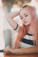 Fototapeta premium Young beautiful woman with pink hair portrait