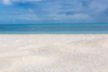 Fototapeta na wymiar White sand background and decoration of sea sky and sun