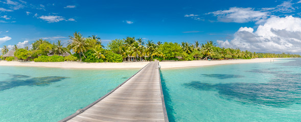 Beautiful tropical Maldives island with beach and wooden jetty. Maldives beach panorama, luxury resort and exotic vacation or holiday concept