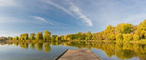 Autumn forest and lake in the fall season