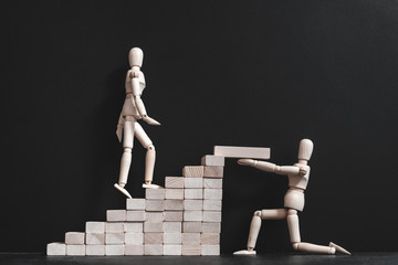 Encouragement and support. Career growth and coaching. Conceptual articulated mannequin...