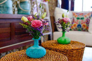 wicker tables with colorful flower pots, rustic coffee tables, rope tables with flower pots, boho style decor, boho style living room decor, boho chic decor, boho chic room, colorful boho room