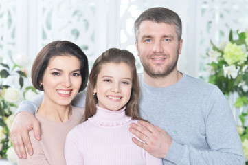 Fototapeta premium Close up portrait of cute little girl with her parents
