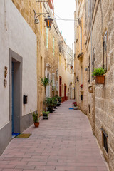 Fototapeta na wymiar Beautiful typical narrow street in Rabat, Malta, streetscape detail