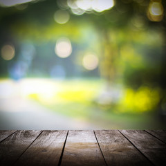 empty wooden on blurred nature backdrop. Wood table top. can used for display or montage your...