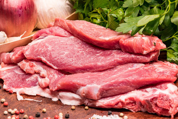 Raw pork ribs in the loin on a wooden board