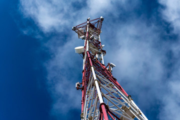Tower of cellular communication against the blue . Bottom-up view.