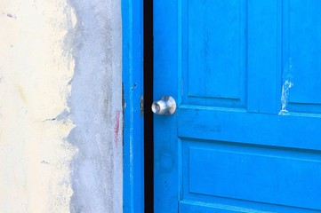 Steel door handle in a blue wooden door (Ari Atoll, Maldives)