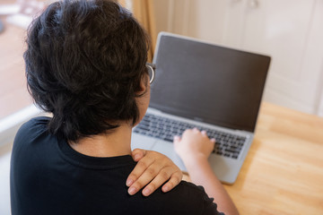 The image behind the female office worker, the student suffering from back pain, working at the computer