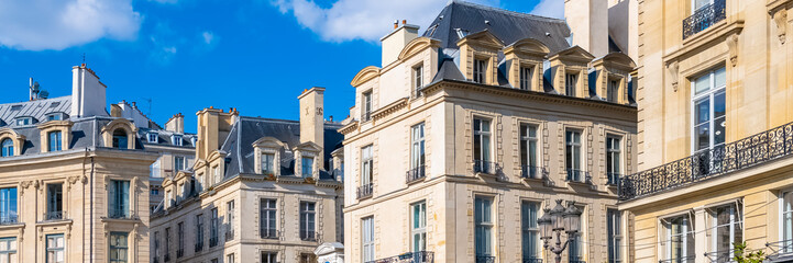 Paris, beautiful buildings place des Victoires, typical parisian facades and windows - obrazy, fototapety, plakaty