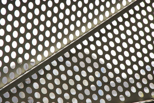 a futuristic architectural style facade concept design wavy and diamond pattern with  aluminium composite panels or cladding with perforated sheets on modern building 