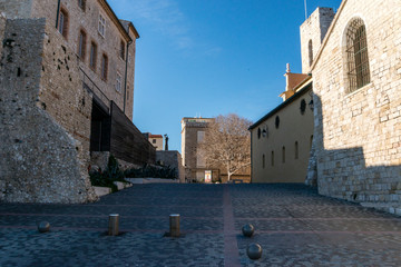 Little square in the medieval village of Antibes in a sunny winter day