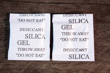 silica gel in paper packaging on wooden