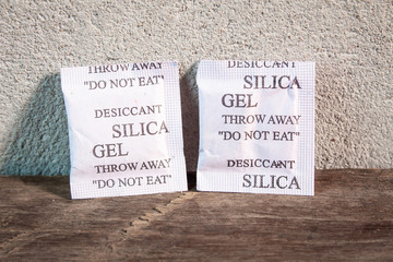silica gel in paper packaging on wooden