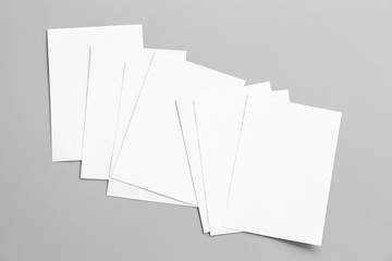 Blank portrait mock-up paper. brochure magazine isolated on gray, changeable background / white paper isolated on gray