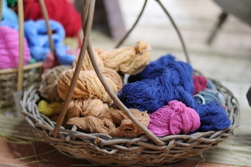 colorful wool yarn and knitting needles