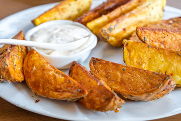 fried potatoes with Mexican sauce on the plate