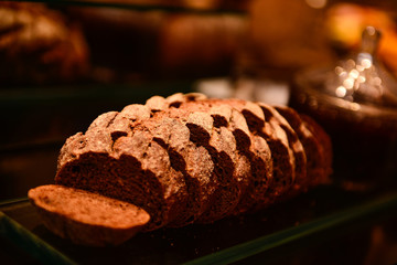 sliced ​​australian bread,whole grain bread, homemade artisan bread loaf, freshly baked sourdough close-up, organic rustic bakery product, gourmet sliced brown bread, photo panel,bread photography