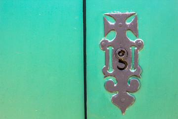 Fototapeta premium Old wooden doors with an old metal door handle knocker