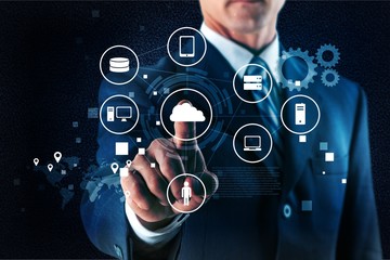 Businessman and analytics symbols on grey background