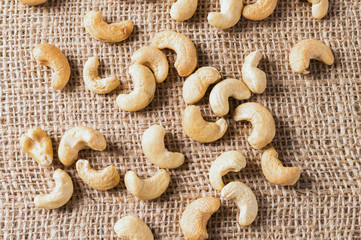 A lot of nuts - cashew nuts on the grey background, top view