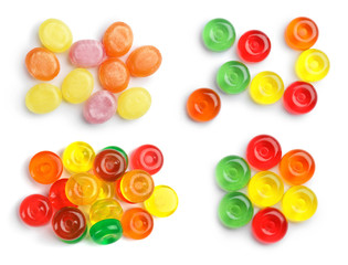 Set of colorful tasty hard candies on white background, top view