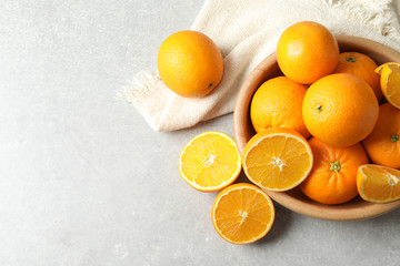 Flat lay composition with ripe oranges and space for text on light background