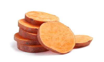 Slices of ripe sweet potato on white background