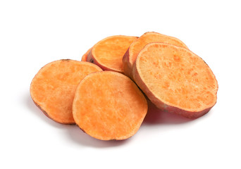 Slices of ripe sweet potato on white background