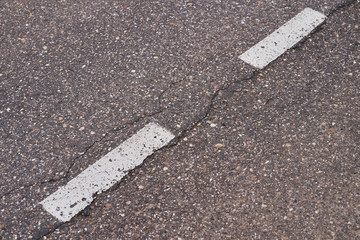 Fototapeta premium The road with asphalt coating and line markings