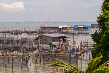 Fototapeta premium Fishermen hut and nets at Songkhla lake