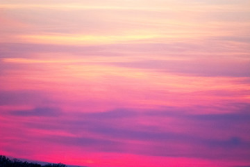 sky and clouds over hills at sunset