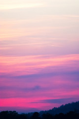 sky and clouds over hills at sunset