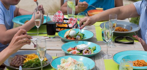 people dine in the restaurant at the outdoor dining table