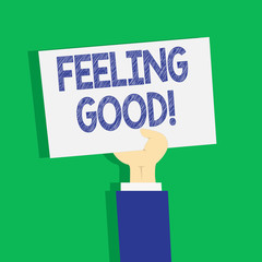 Text sign showing Feeling Good. Business photo text causing happy positive feelings about life have satisfaction Clipart of Hand Holding Up Blank Sheet of White Paper on Pastel Backdrop