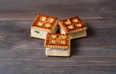Cookies with marshmallows and marmalade on a wooden table. Fresh homemade pastries.