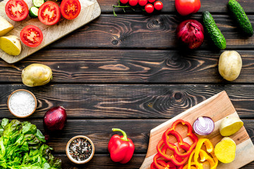 cooking with raw vegetables on dark wooden background top view mockup
