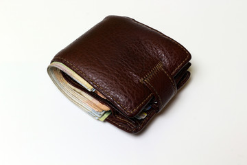 Brown wallet on white background isolated.