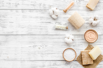 Spa set with eco materials for organic treatment on white wooden background top view space for text