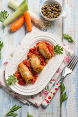 filled sepia with tomatoes capers carrots and leek