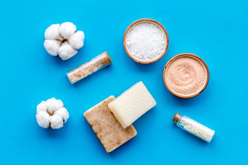 Spa set with eco materials for organic treatment on blue background top view