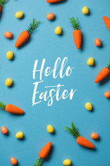 Easter festive background with easter bunny carrots and easter eggs