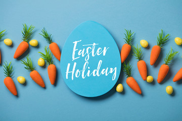 Easter festive background with easter bunny carrots and easter eggs